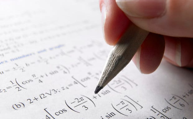 Hand doing math homework